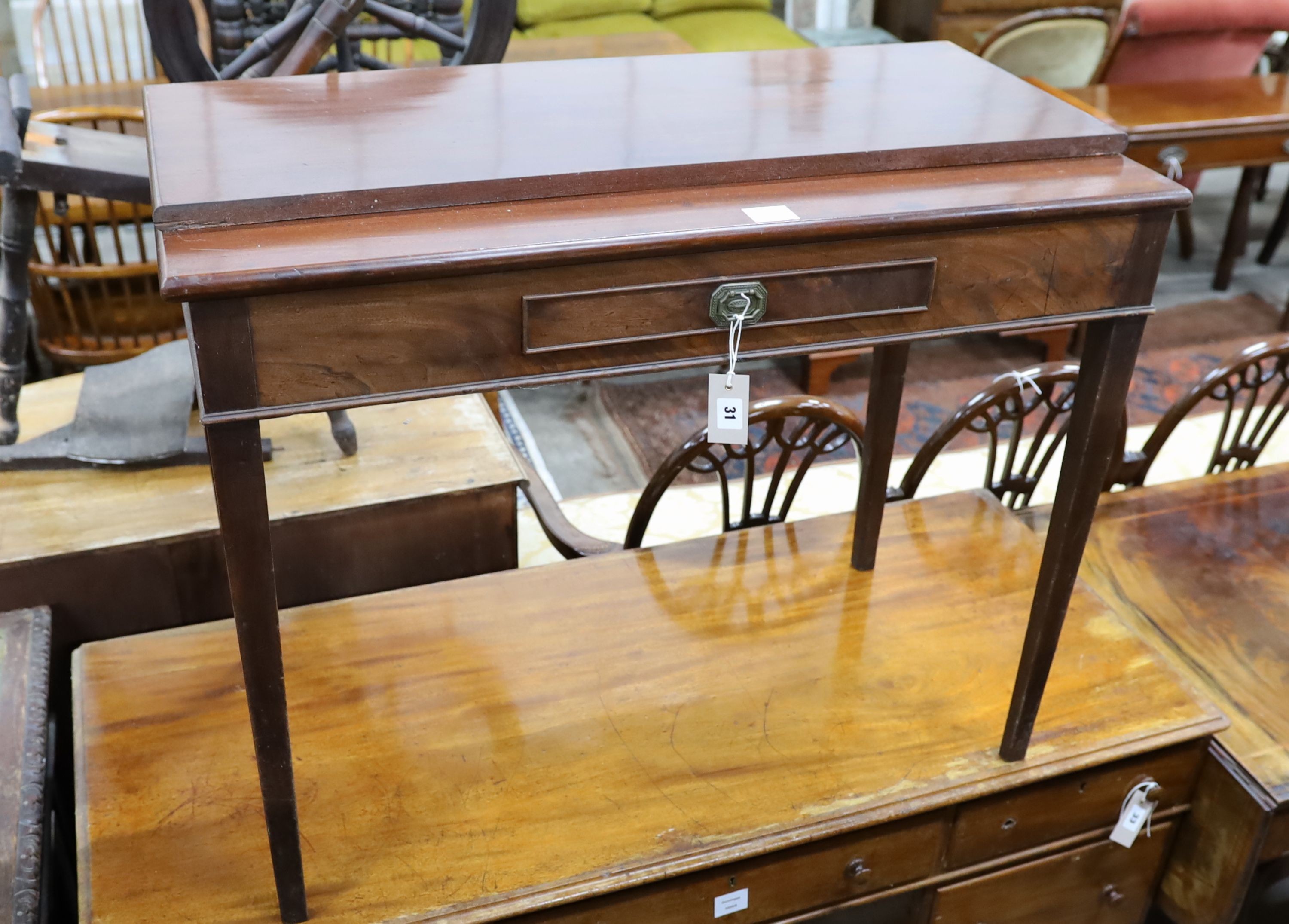 A George III rectangular mahogany folding tea table (altered), width 92cm, depth 46cm, height 74cm